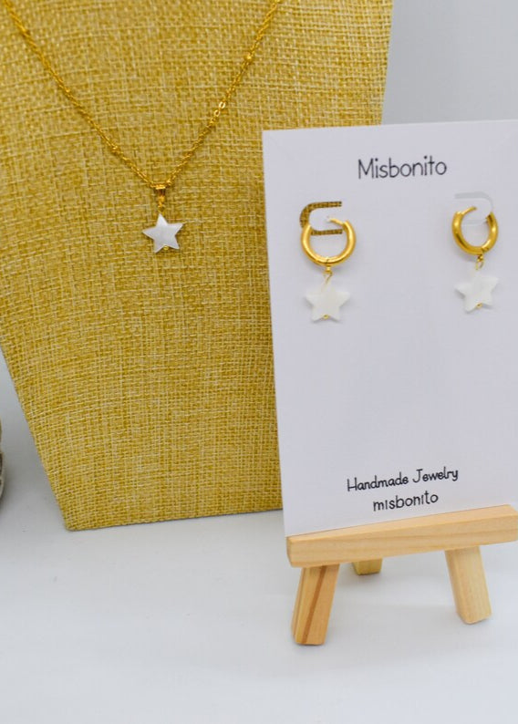 Star jewelry set on a display earrings and necklace made with nacar star charms
