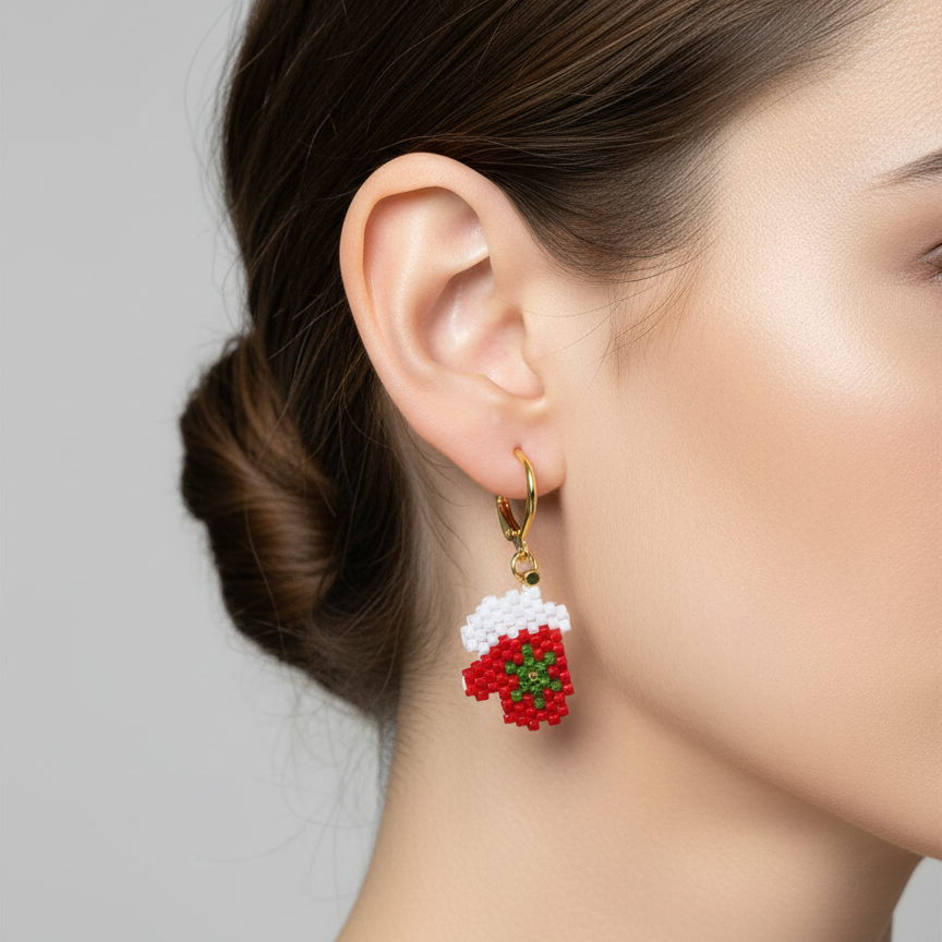 Close-up of a person wearing a floral earring against a neutral background