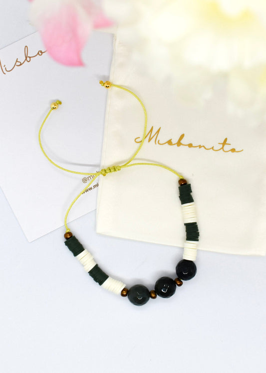 Bracelet with green agate and polymer clay beads with a pouch on the background