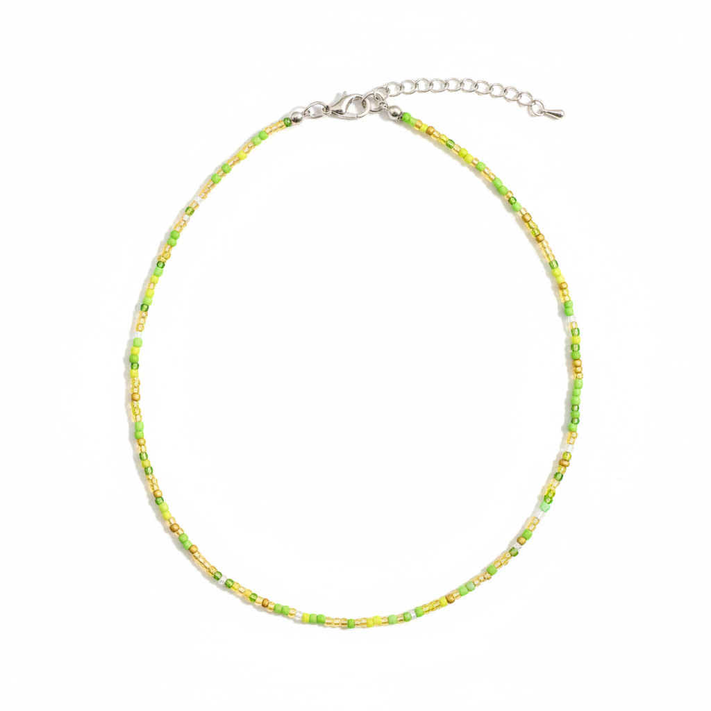Green beaded necklace on a neutral background