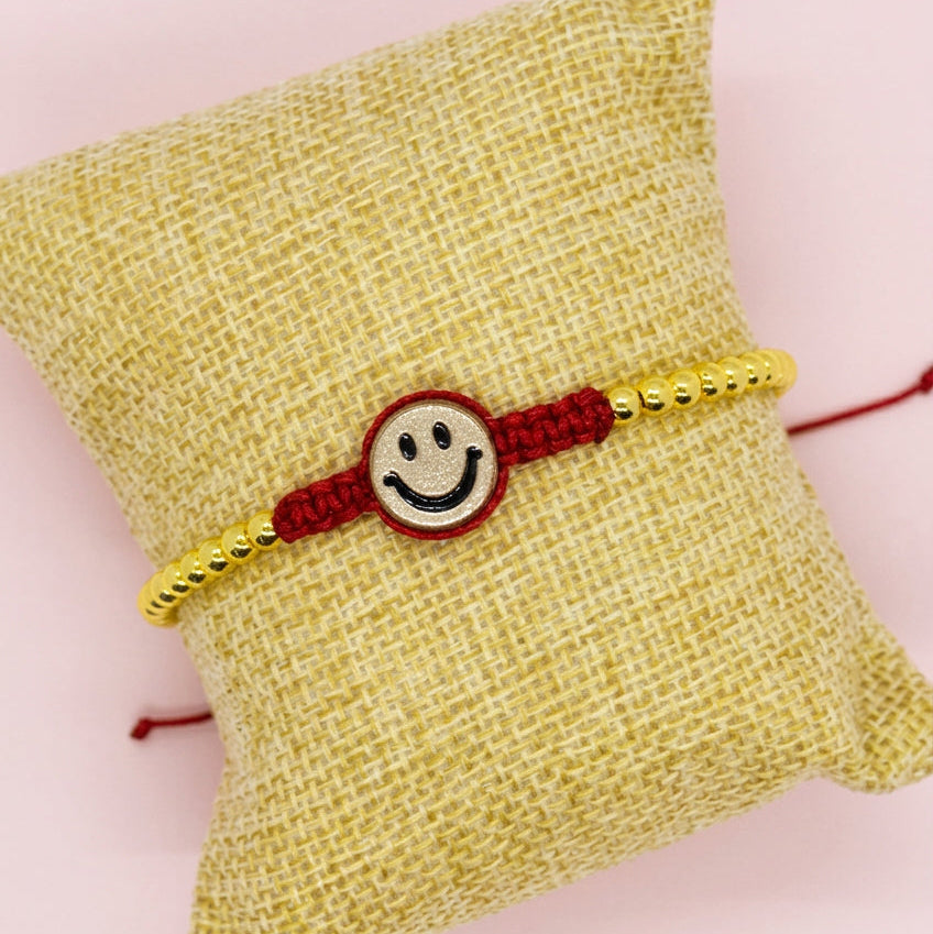 Happy face bracelet red