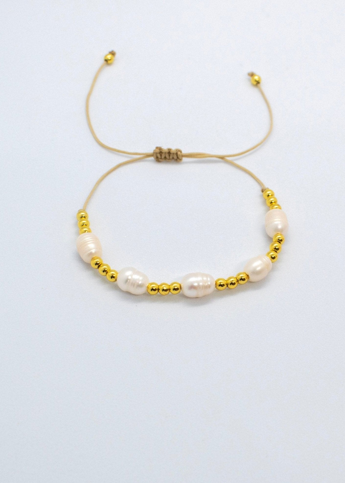 Pearls and gold bracelets