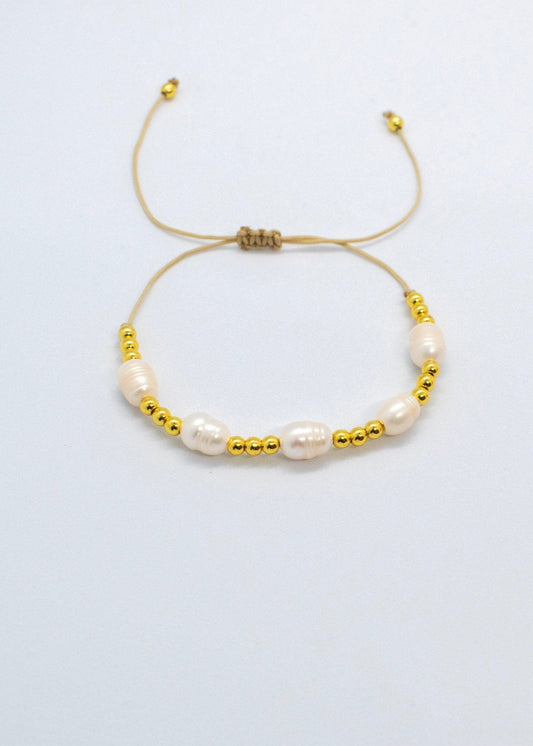 Pearls and gold bracelets