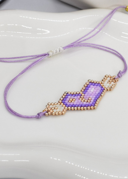 Purple wings adjustable bracelet on a tray
