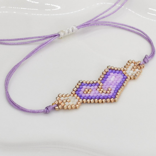 Purple wings adjustable bracelet on a tray