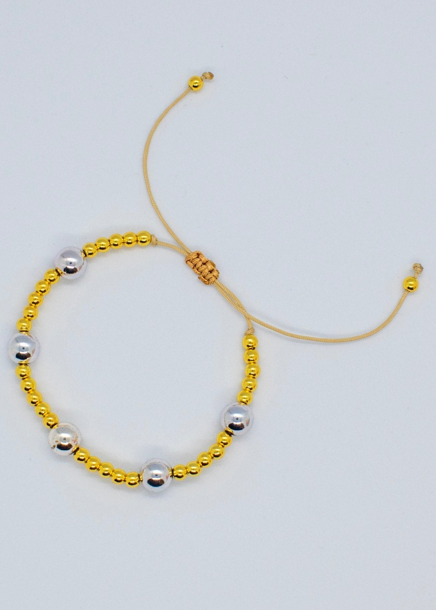 Silver and golden beads bracelet