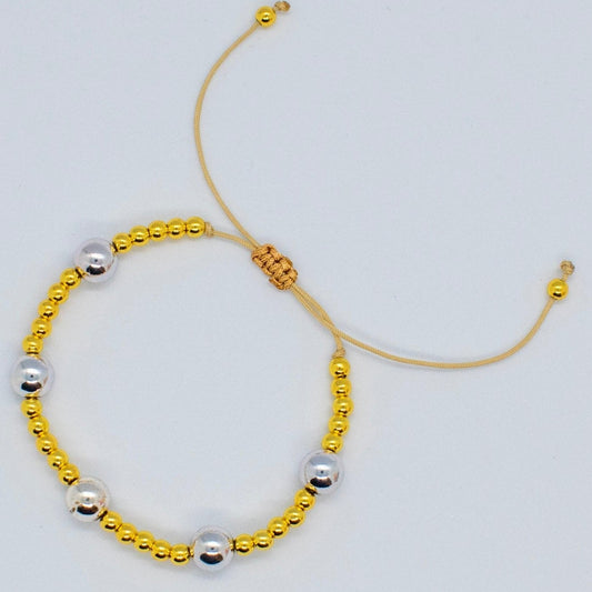 Silver and golden beads bracelet