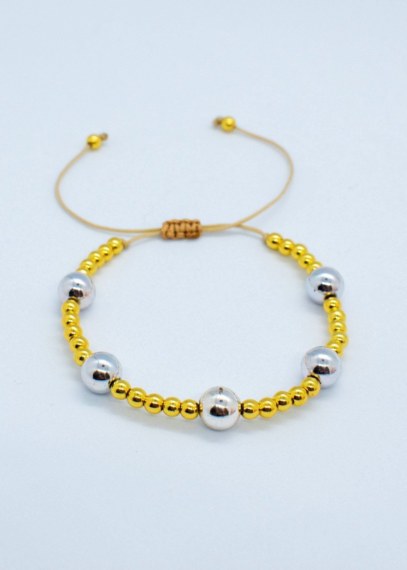 Silver and golden beads bracelet