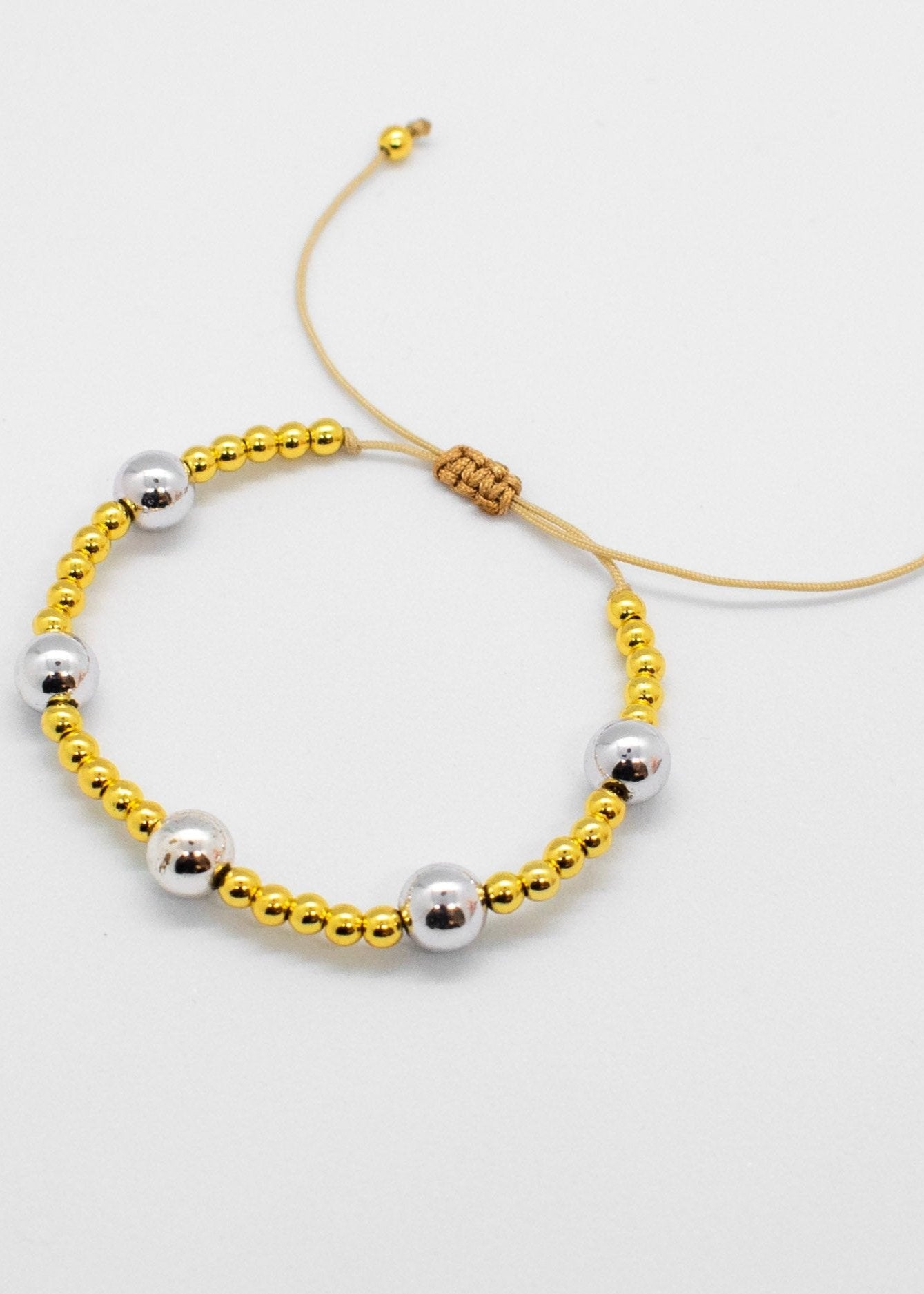 Silver and golden beads bracelets