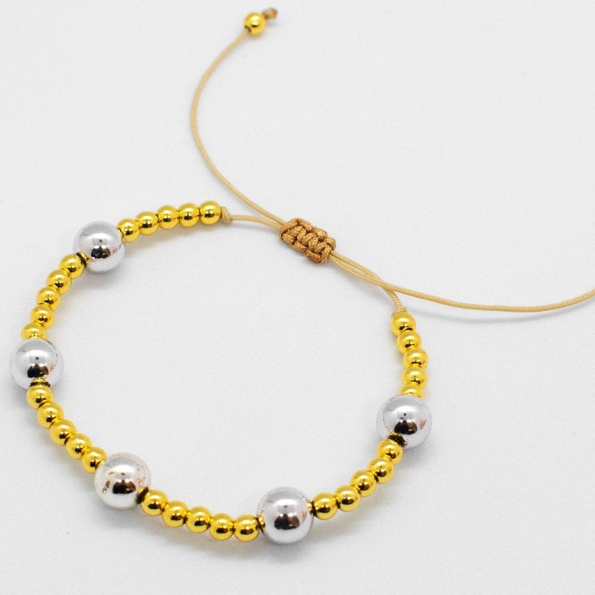 Silver and golden beads bracelets