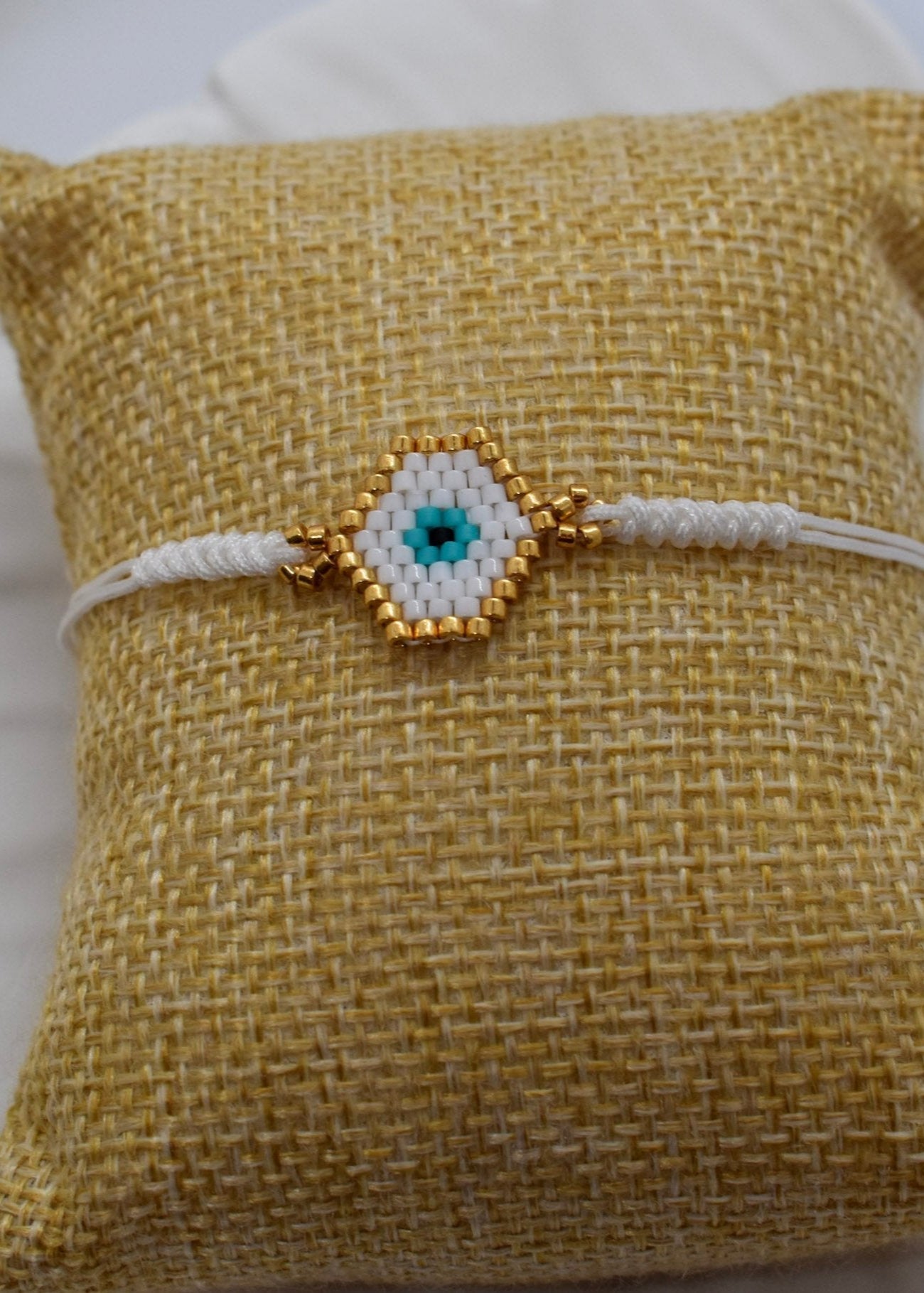 White evil eyes bracelet