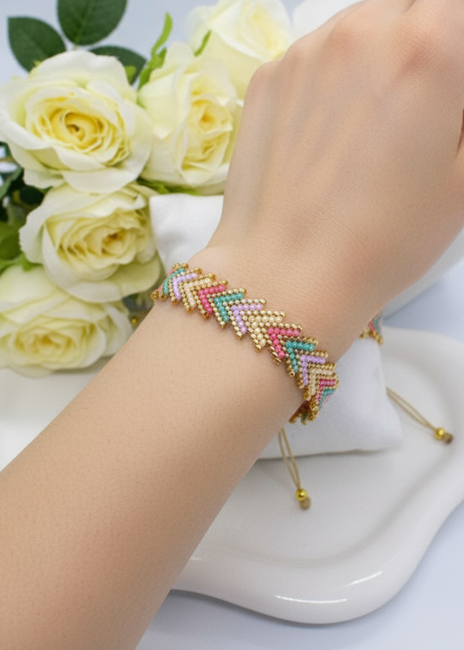 Ai model wearing a colorful beaded bracelet on a wrist with white roses in the background