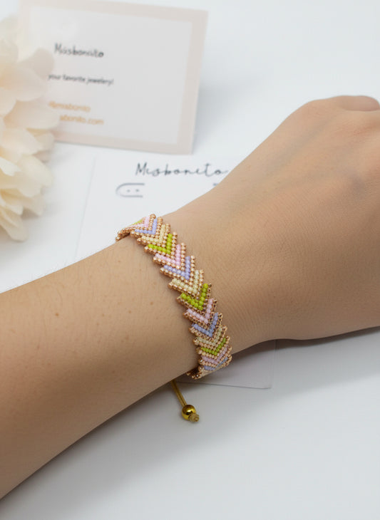 Ai models arm wearing an arrow bracelet