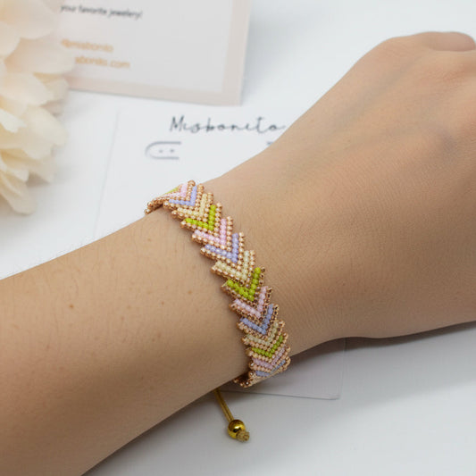 Ai models arm wearing an arrow bracelet