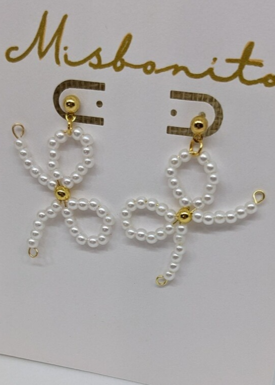 coquette earrings on a card
