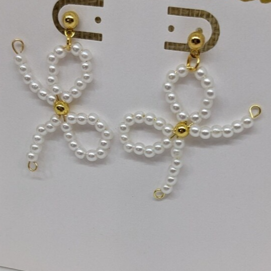 coquette earrings on a card