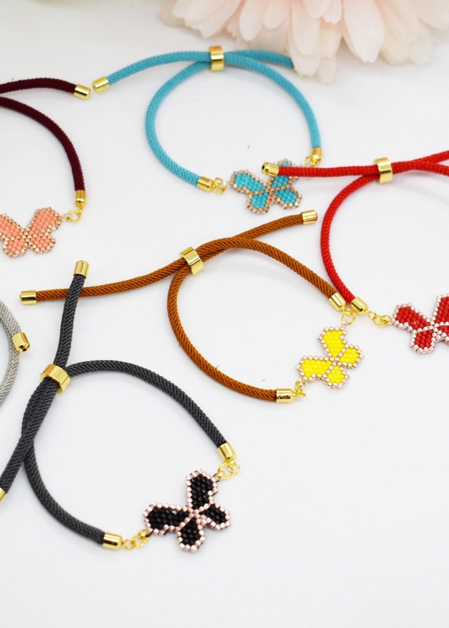 Beaded butetrfly cord bracelets