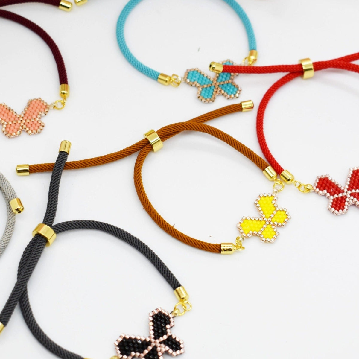 Beaded butetrfly cord bracelets