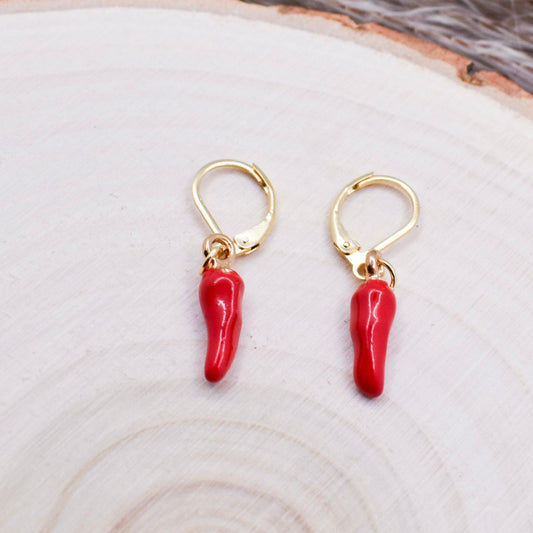 chili earrings hoops on a wood surface