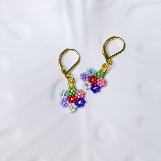 Colorful beaded earrings on a white background