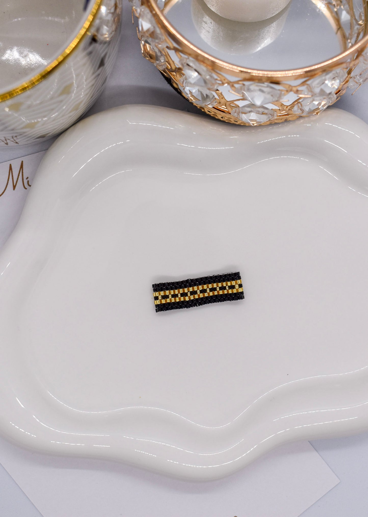 golden and black ring