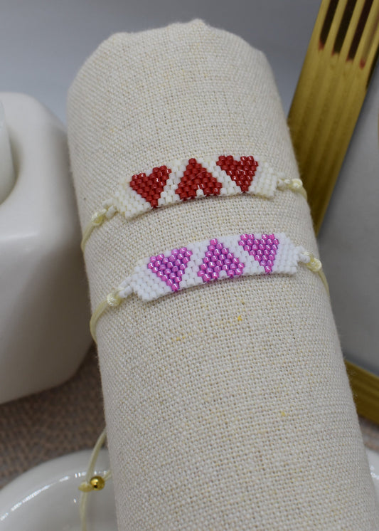 heart bracelets on a tube display