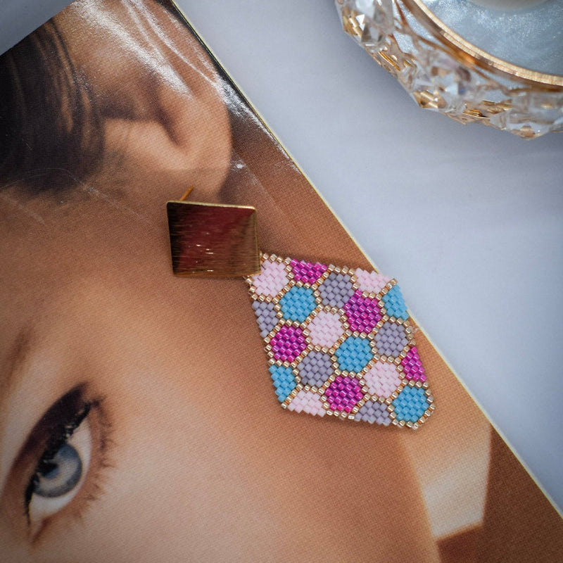 honeycomb pink earrings on model