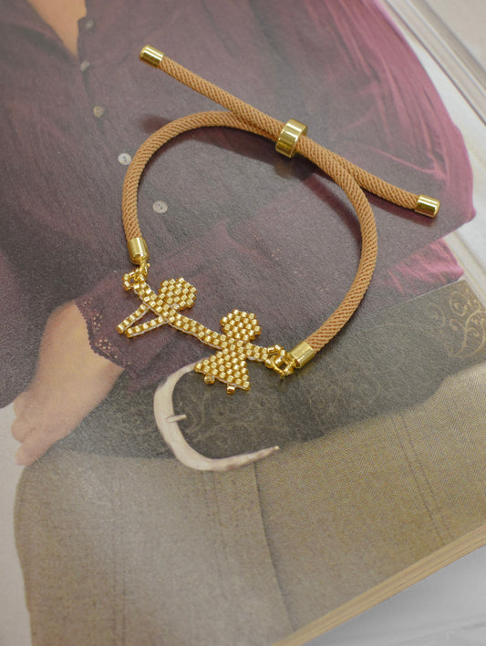 Brown bracelet on a magazine