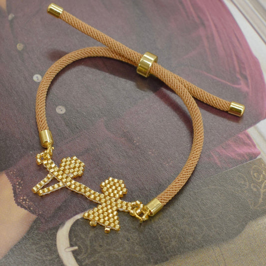 Brown bracelet on a magazine