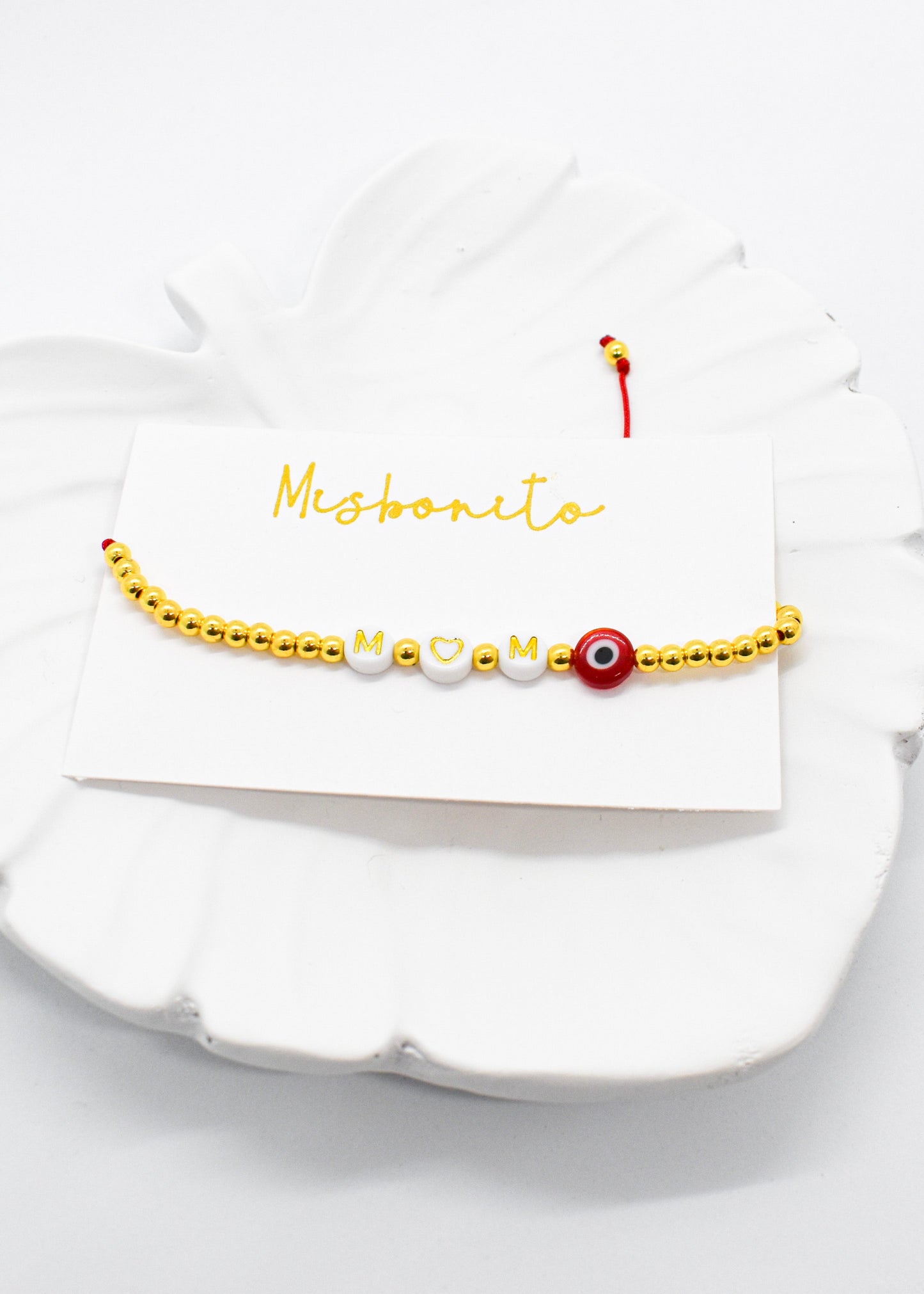 mom evil eye bracelet on a tray