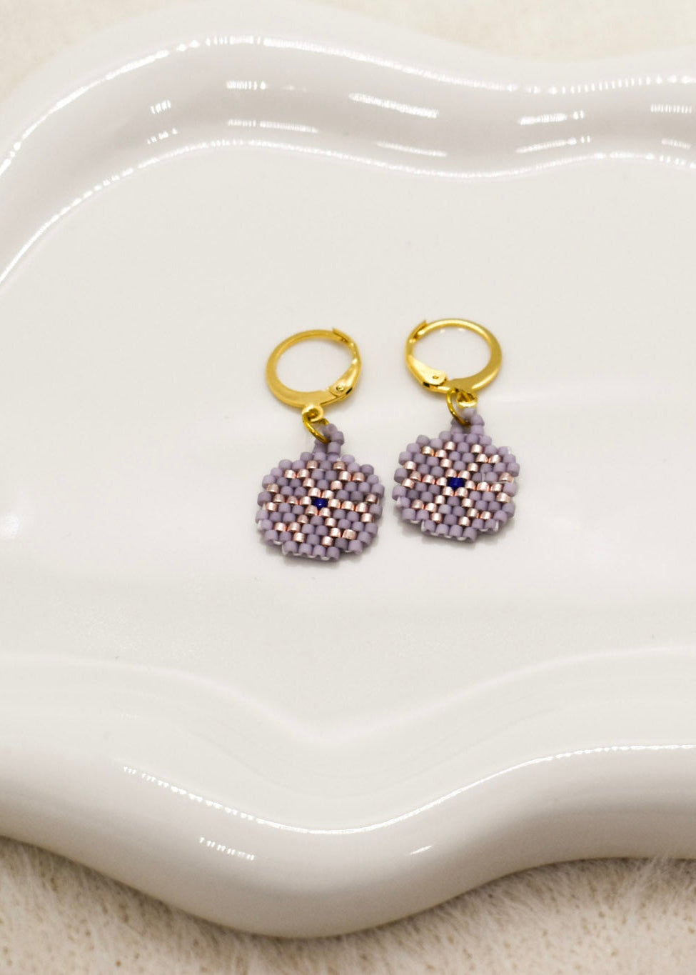 purple earrings snow