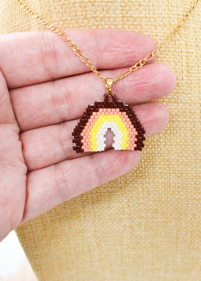 Rainbow necklace on hand