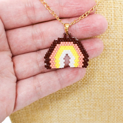 Rainbow necklace on hand