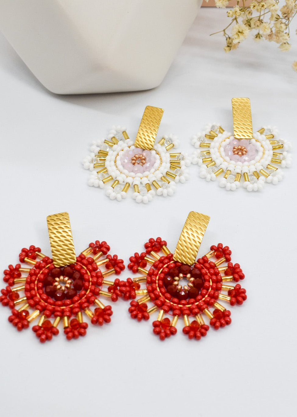 red and white statement round earrings