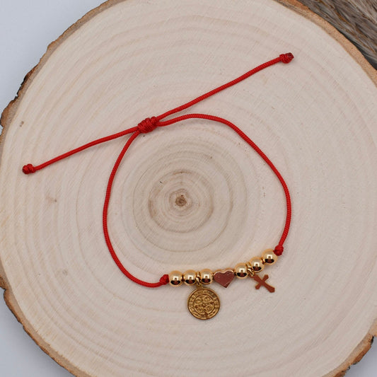 red string bracelet with st benedict and cross