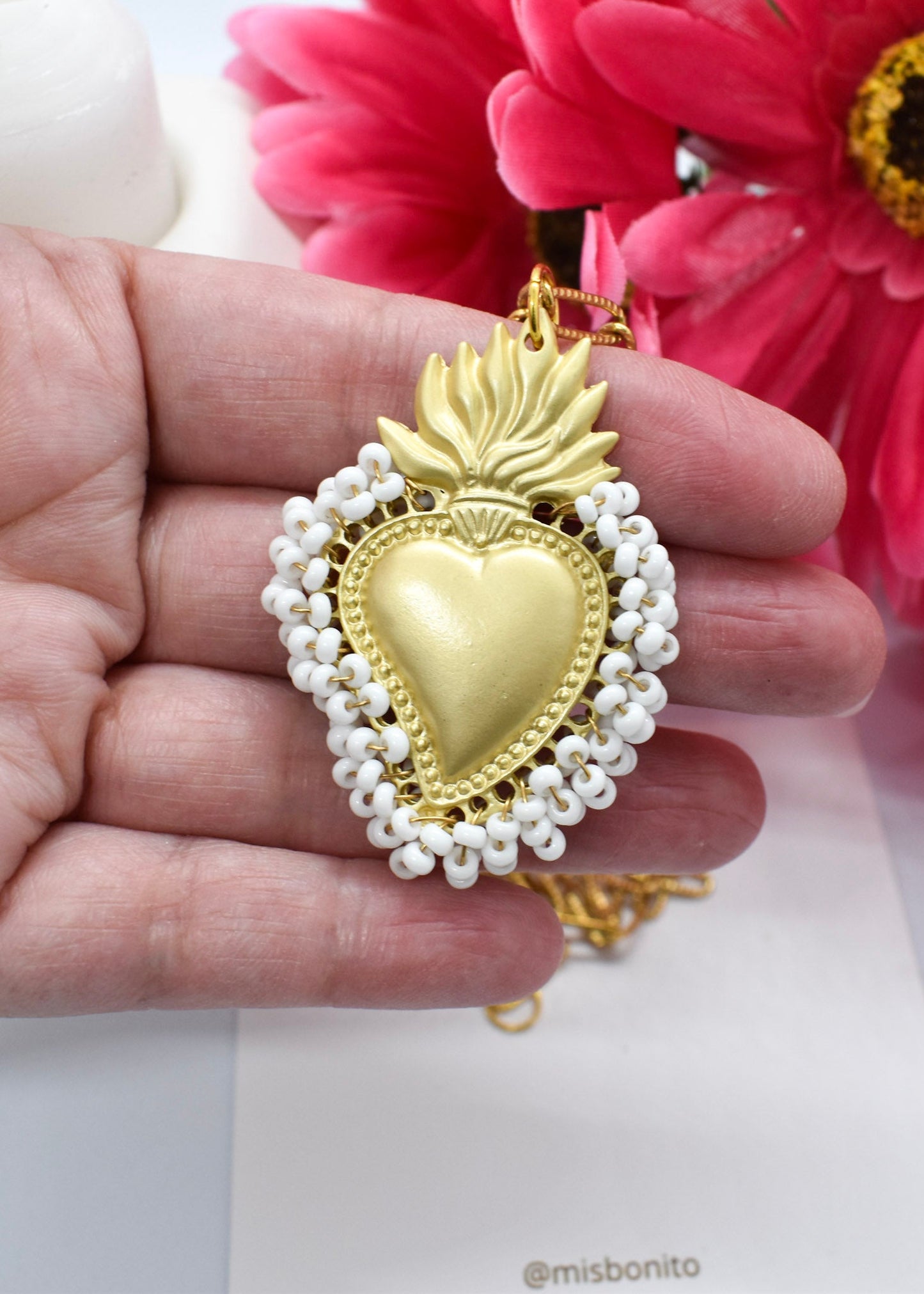 sacred heart of Jesus necklac on hand