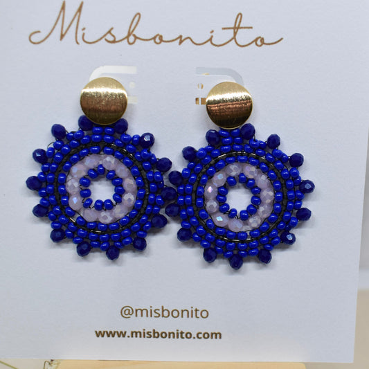 Blue beaded earrings on a Misbonito branded card.