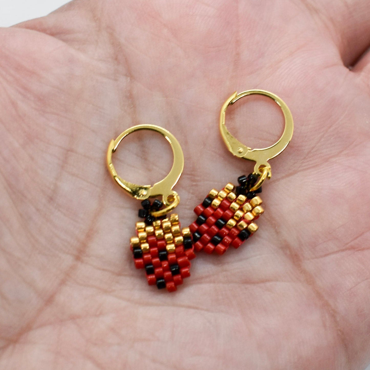 strawberry beaded earrings on hand