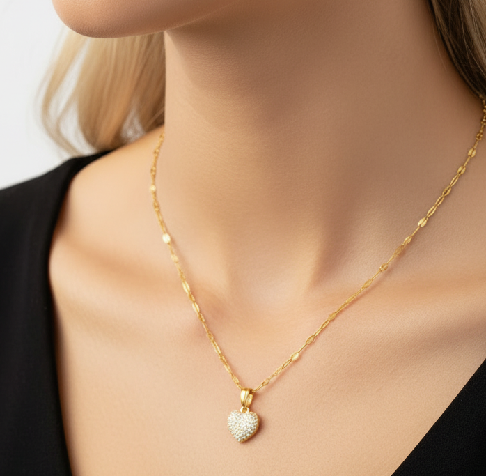 a model wearing a heart and earrings set