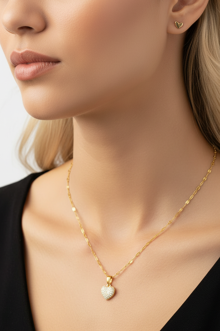 a model wearing a heart and earrings set