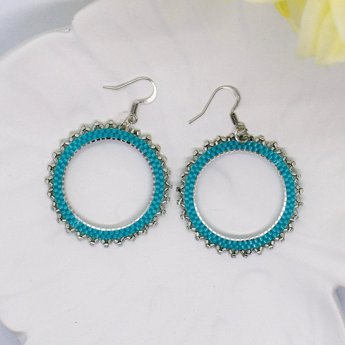 turquoise earrings on tray