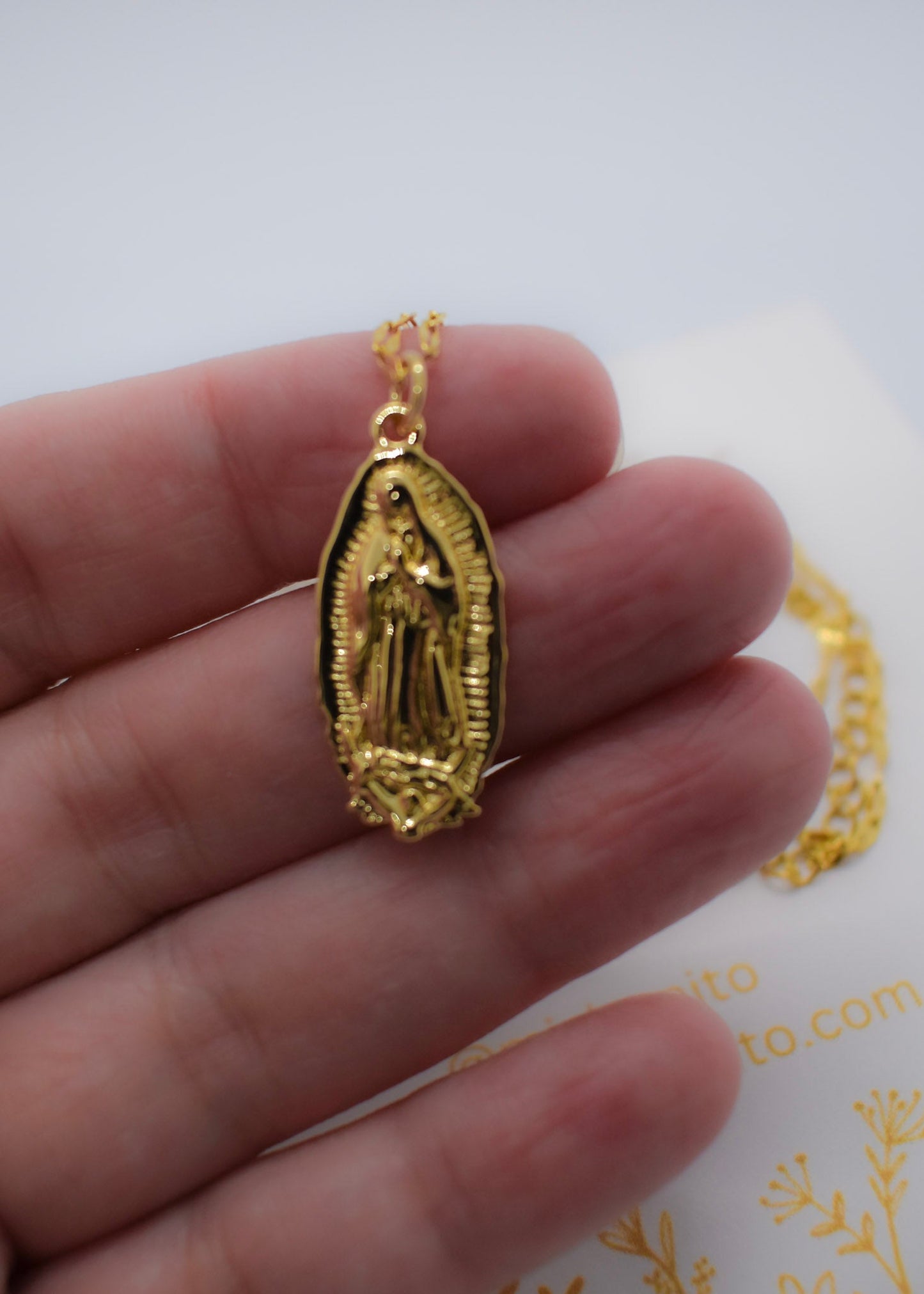 virgin siluetas necklace on hand