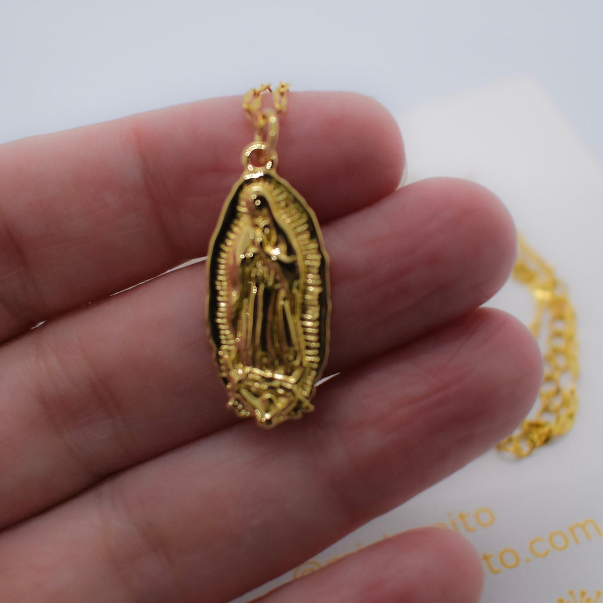 virgin siluetas necklace on hand