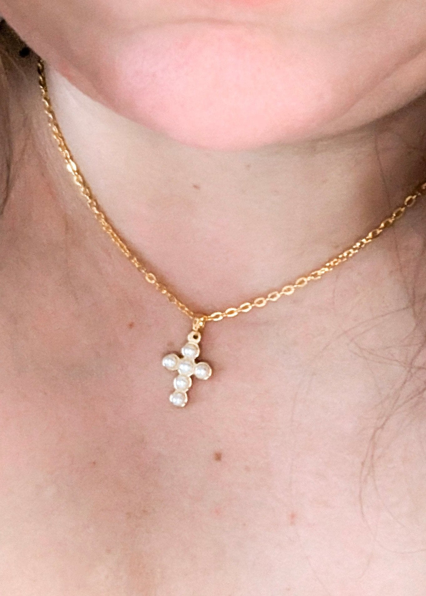 wearing cross necklace