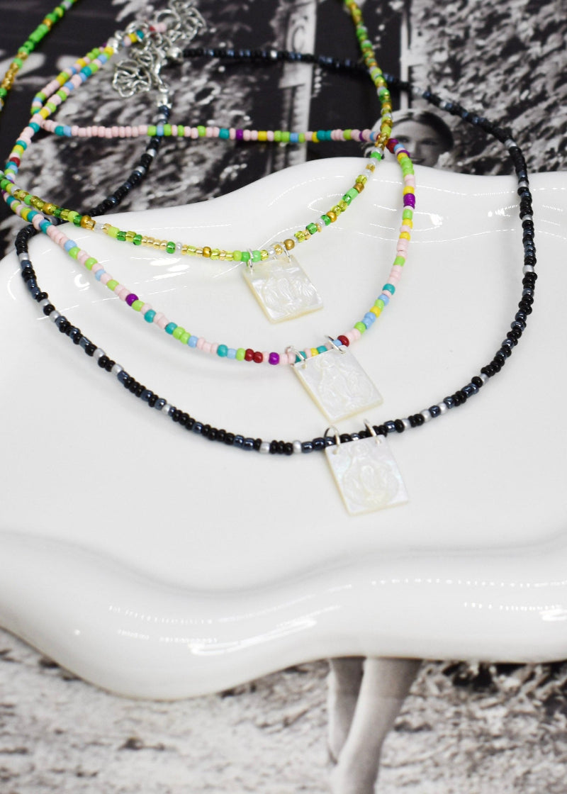 whiteshell scapular necklaces