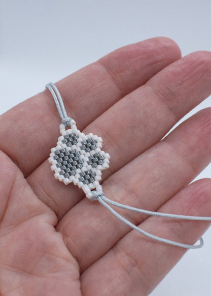 Miyuki grey paw bracelet