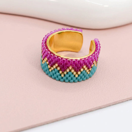 Multicolored beaded ring on a white background