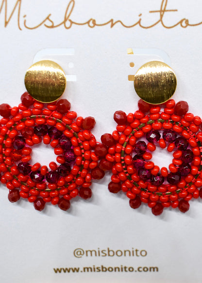 Red beaded earrings with gold accents on a Misbonito branded card.