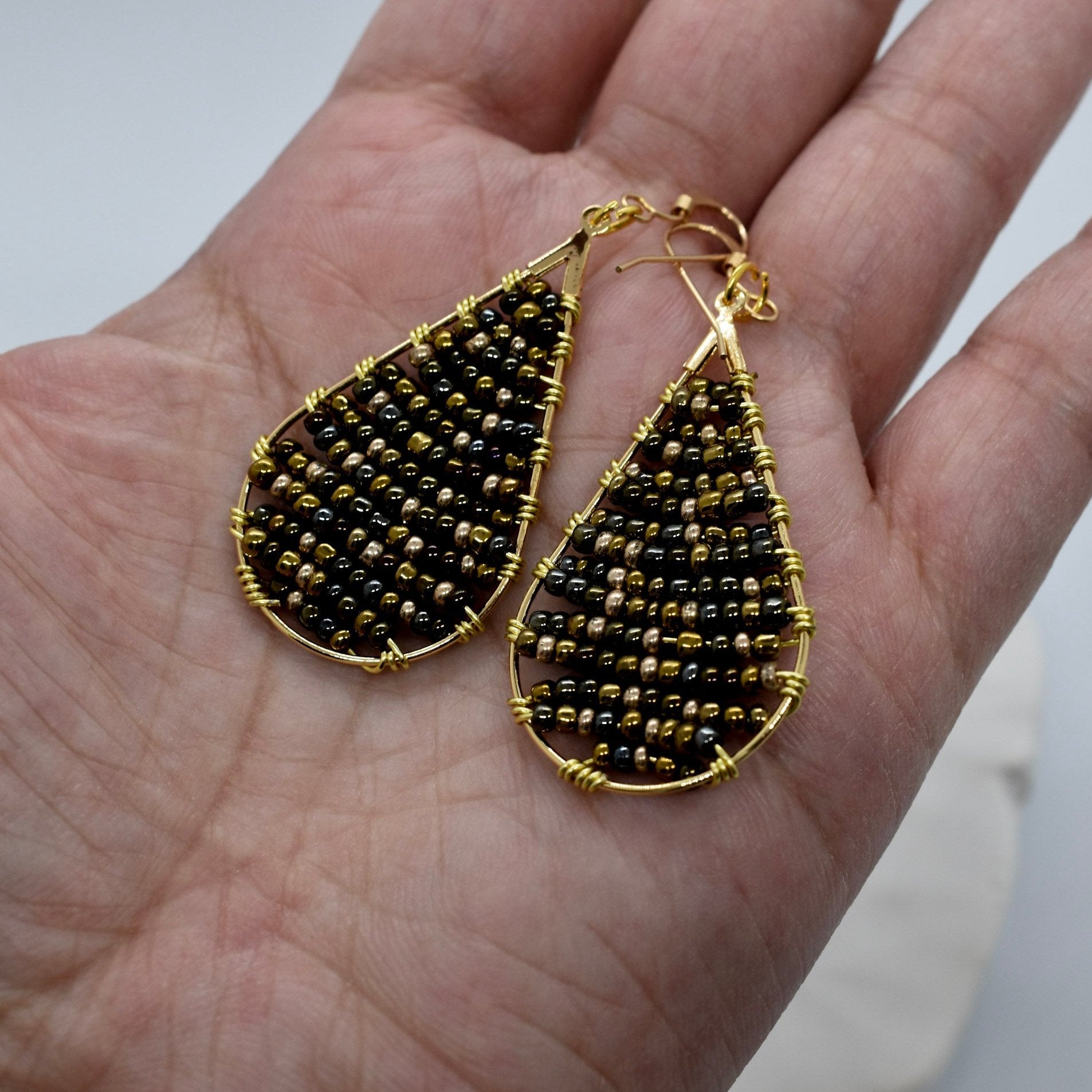 Shimmering beaded oval earrings