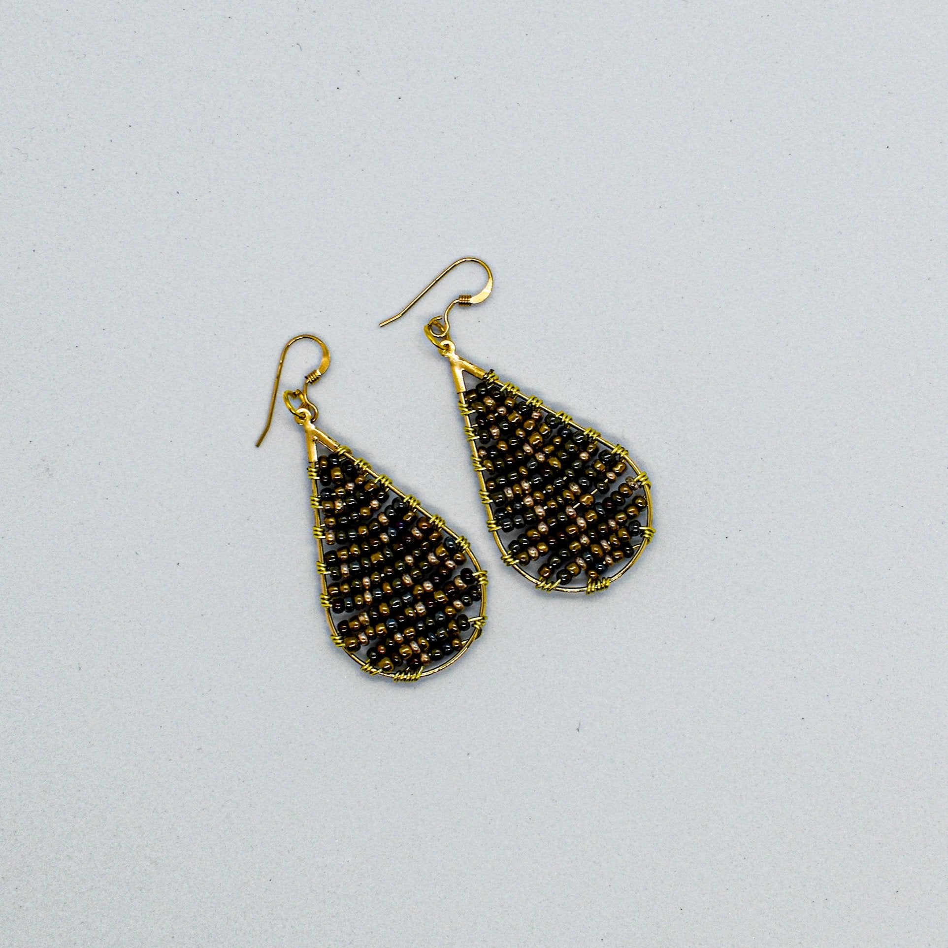 Shimmering beaded oval earrings